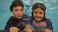 Children swim miles for charity