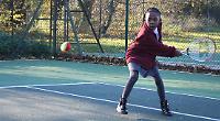 Tennis coach gives tips to hundreds of children