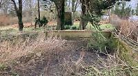 Villagers clear disused water tank of overgrown scrub