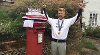 Knitted topper that captures cox’s gold medal celebration