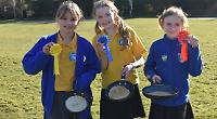 Pancake race returns in sunshine