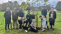 School plants two trees for 100th birthday