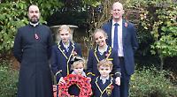Children taught lesson in forgiveness as they pay tribute with poems and wreaths