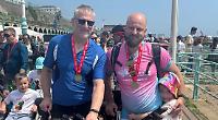 Man finishes cycle ride in memory of father and son
