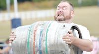 Strongman display pulls in crowds at school fun day