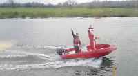 Santa arrives for lunch by boat