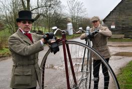Famed penny-farthing duo delay their mammoth trip but plan to keep on rolling