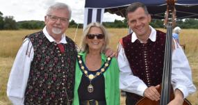 Friends make song and dance in field