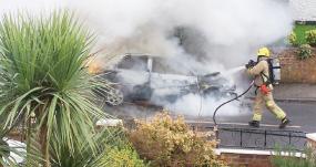 Car ablaze near closure-threatened fire station