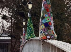 Knitting group adorn bridge with ‘trees’ in aid of church