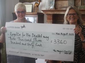 Ex-mayor presents £6,720 to two charities
