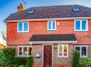 Champion of poor gives his name to village home