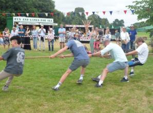 Villages come together for fete (and try pulling apart)
