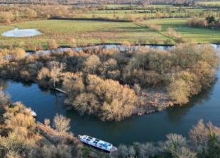 Heavily wooded island in Thames sold at auction for almost &pound;100,000