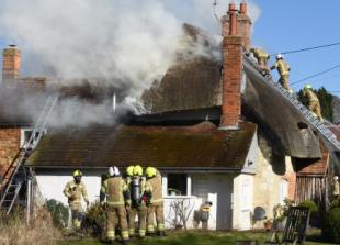 Thatched cottage badly damaged in roof blaze