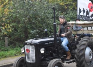 Tractors take people to farm service