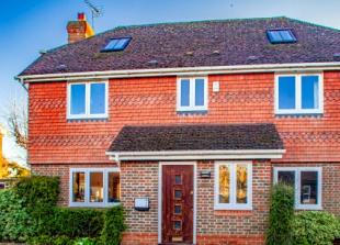 Champion of poor gives his name to village home