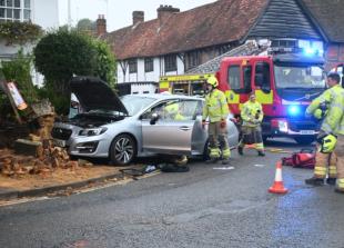 Driver rushed to hospital after car ploughs into wall