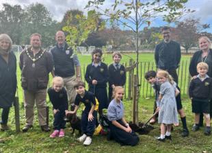 School plants two trees for 100th birthday