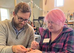MP (and family) in knitting workshop at cafe
