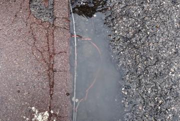Car park pothole which exposed mains wires deemed safe by council