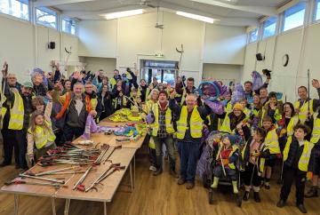 Baby joins village spring cleaners