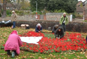Villagers knit 1,750 poppies for remembrance art installation
