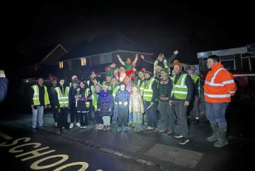 Santa with snow machine spreads festive cheer