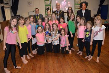 Schoolchildren sing Sixties hits for music competition