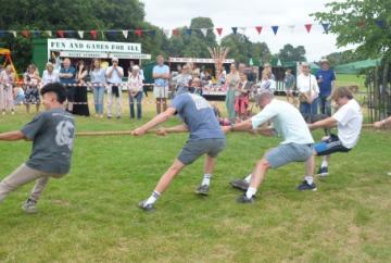 Villages come together for fete (and try pulling apart)
