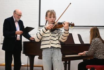 Children show confidence in playing for each other