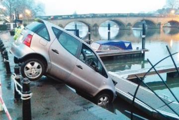 Elderly woman rescued after accidentally driving into river