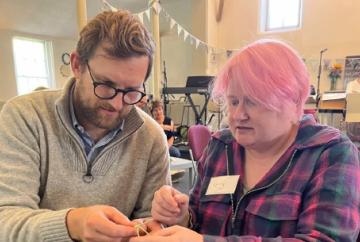 MP (and family) in knitting workshop at cafe