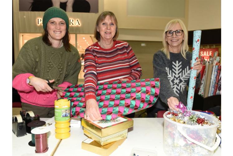 Volunteers wrap gifts in Maidenhead's Nicholsons Centre to raise funds for Thames Hospice