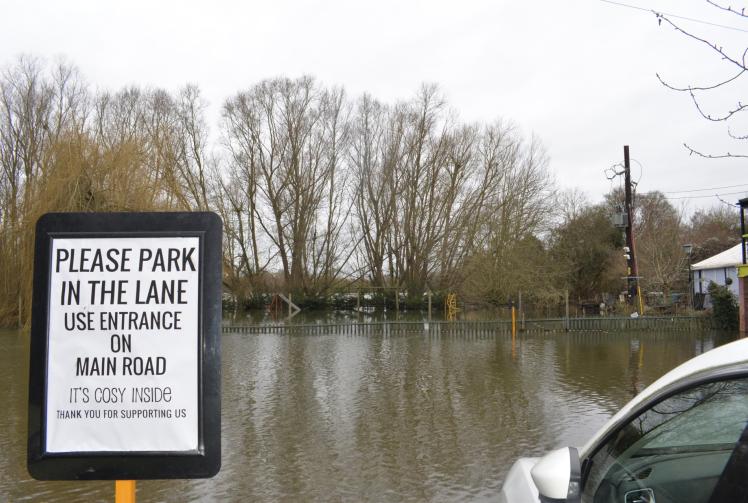 Flowing Spring pub remains open for business despite flood-hit car park