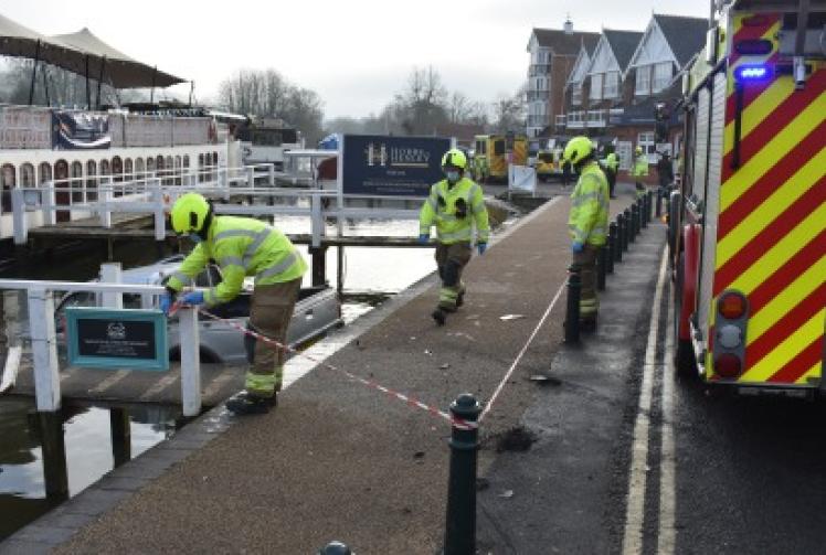 Truck crashes through bollards into river