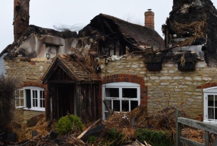 Thatched cottage badly damaged in roof blaze
