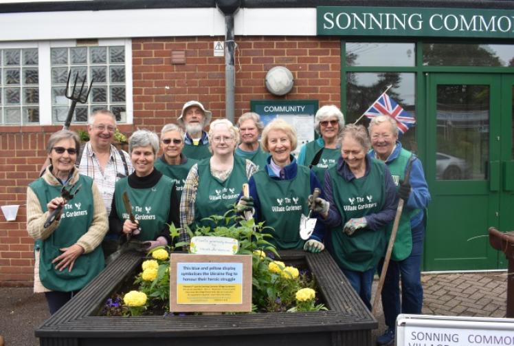 Volunteers plant up flower beds in colours of Ukraine