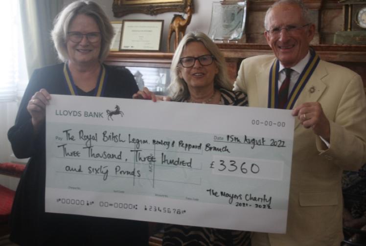 Ex-mayor presents £6,720 to two charities