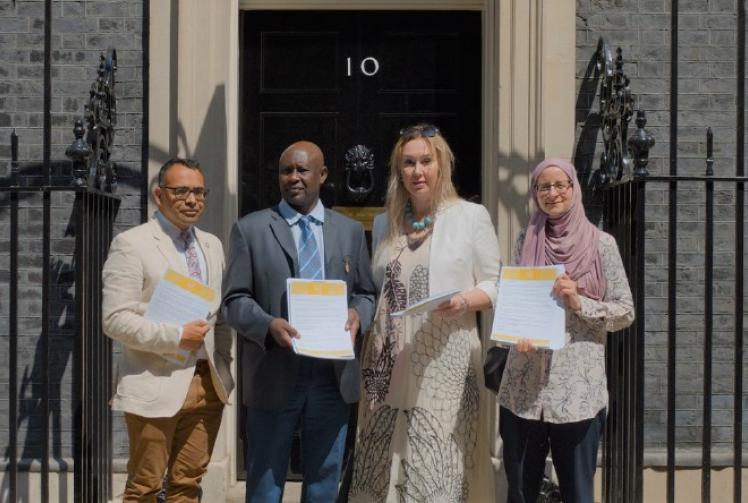 Campaigner helps deliver Sudanese refugees petition to Downing Street