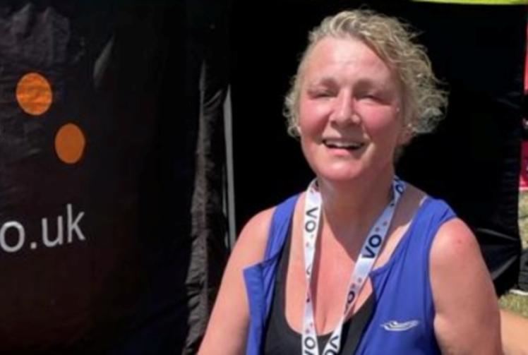 Woman with rare disease battles through triathlon