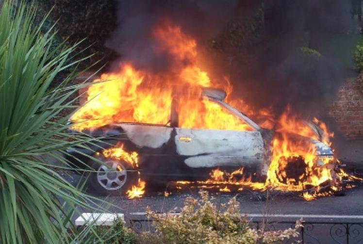 Car ablaze near closure-threatened fire station
