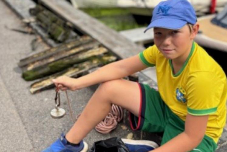 Boy, 11, fishes out litter from Thames