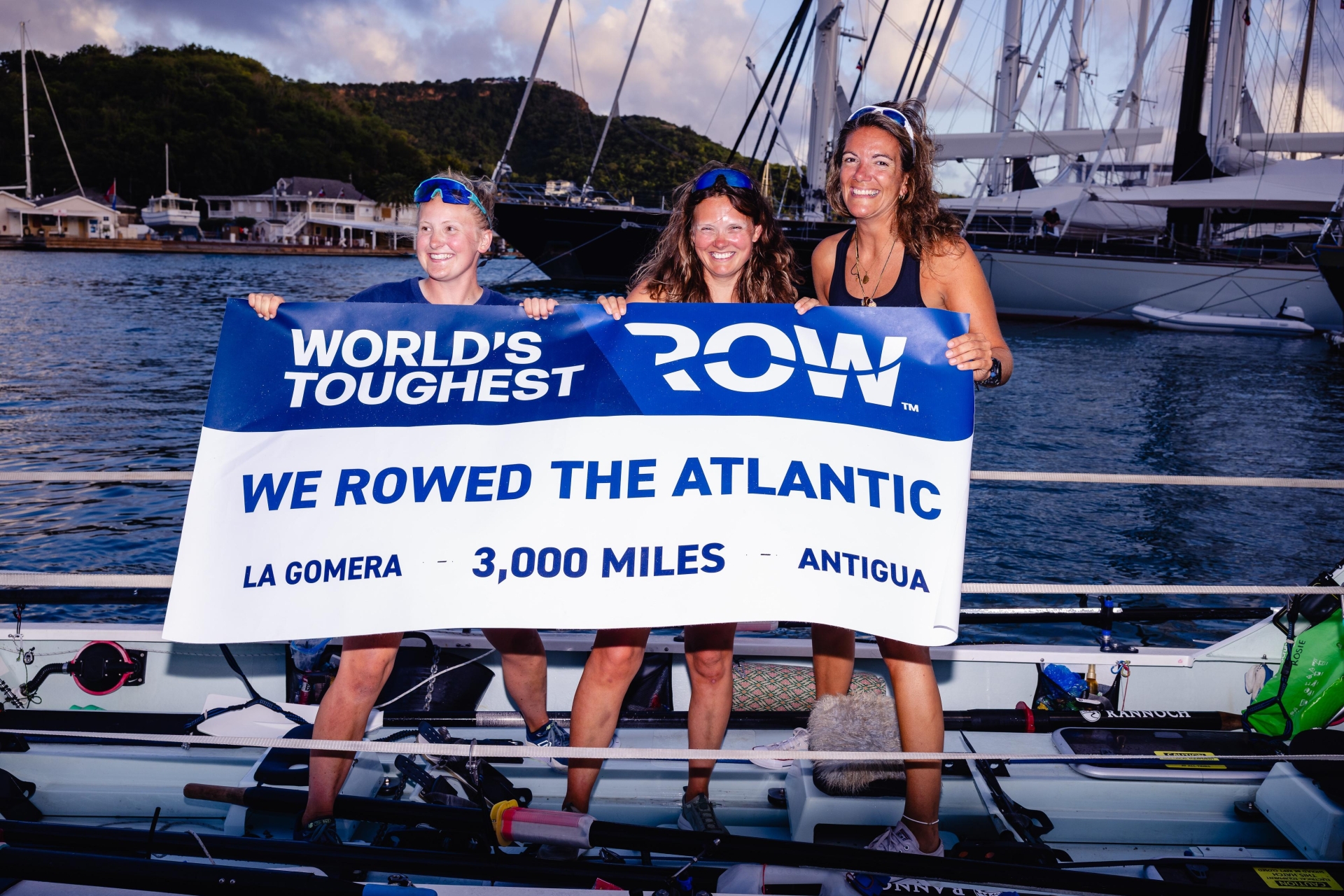 Rosie Tong, left, arrives with her crewmates Mel Jarman and Clare O'Reilly. Photo: The World's Toughest Row